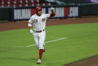 Cincinnati Reds' Joey Votto (19) points to the grounds crew after hitting a two-run home run in the sixth inning during a baseball game against the Cleveland Indians in Cincinnati, Monday, August 3, 2020. (AP Photo/Aaron Doster)