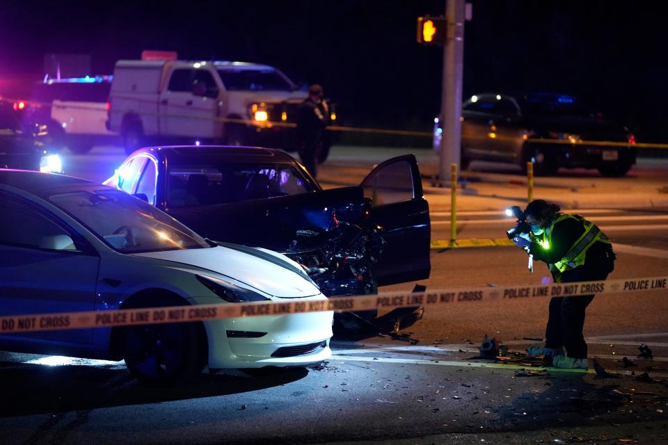 A crime scene technician photographs the scene at RM 1826 and Texas 45 where Shane James Jr. was arrested Dec. 5 after a police chase.