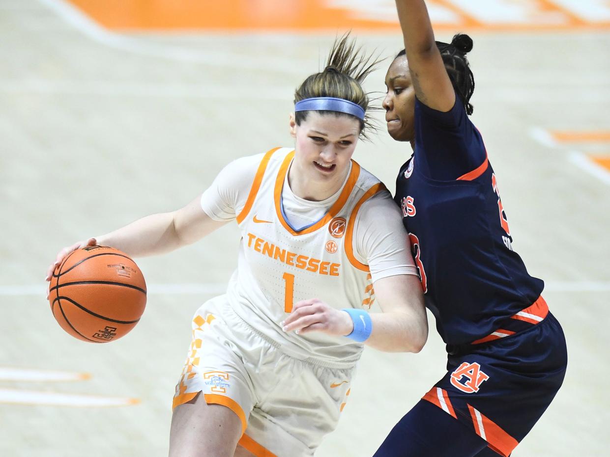 Tennessee's Sara Puckett (1) tries to get past Auburn's Honesty Scott-Grayson (23) during the NCAA college basketball game between the Tennessee Lady Vols and Auburn Tigers in Knoxville, Tenn. on Sunday, February 19, 2023. 