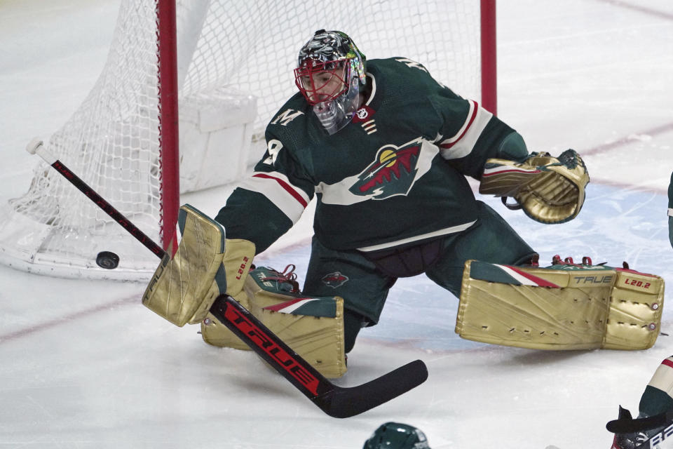 FILE -Minnesota Wild goalie Marc-Andre Fleury deflects a shot during the first period of the team's NHL hockey game against the Colorado Avalanche, Friday, April 29, 2022, in St. Paul, Minn. Fleury begins his first full season with the team, after arriving in a deadline-day trade last March. The three-time Stanley Cup winner is entering his 19th season in the NHL. (AP Photo/Jim Mone, File)