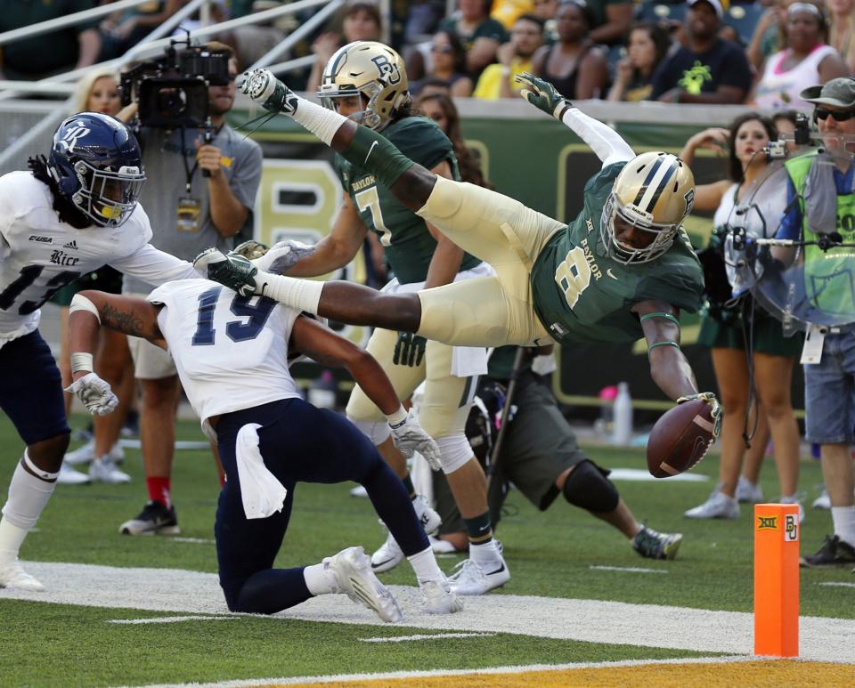 Baylor receiver Ishmael Zamora (8) scores over Rice safety VJ Banks (19), Saturday, Sept. 26, 2015, in Waco, Texas. (AP Photo/Rod Aydelotte)