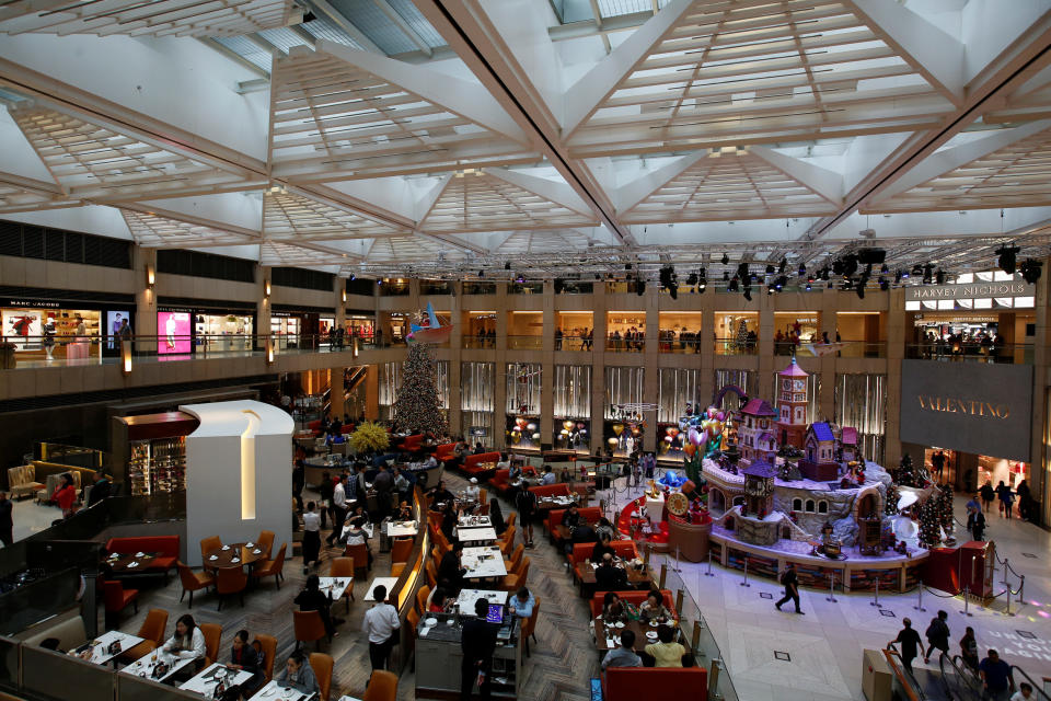 Astrid walks through <a href="https://www.landmark.hk/en/default" target="_blank" rel="noopener noreferrer">the Landmark shopping mall</a> in Hong Kong on her way to Charlie's office.