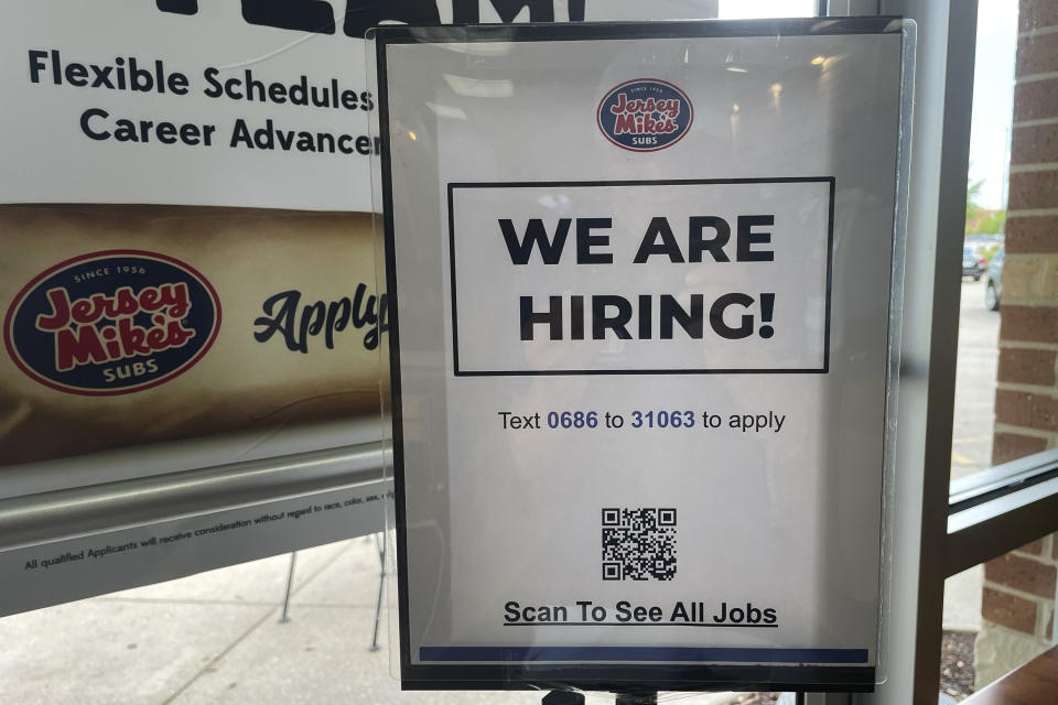 A hiring sign is displayed at a restaurant in Mount Prospect, Ill., Thursday, July 6, 2023. On Friday, the U.S. government issues the June jobs report. (AP Photo/Nam Y. Huh)