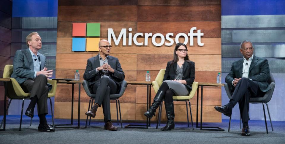 From left, Microsoft General Counsel and Executive Vice President Brad Smith Microsoft CEO Satya Nadella, Microsoft CFO and Executive Vice President Amy Hood and Microsoft Chairman of the Board John Thompson take part in the “Question and Answer” Session during the Microsoft Annual Shareholders meeting, on December 2, 2015 in Bellevue, Washington. (Photo by Stephen Brashear/Getty Images)