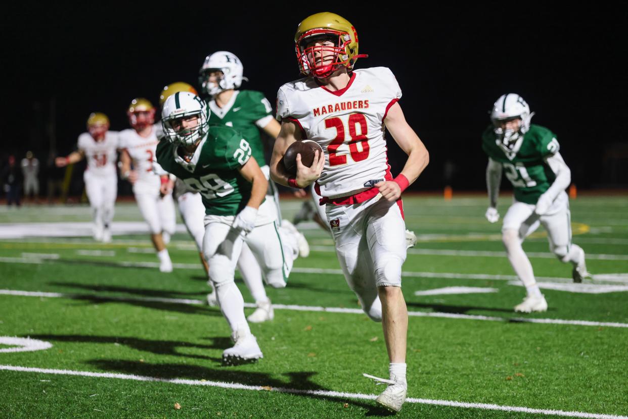 Mount Olive RB Adam DeCristofaro finds daylight on his way to a long TD run.