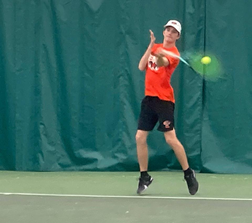 Cathedral Prep's Gavin Ferretti hits a forehand volley against Hickory's Jacob Jarzab during their semifinal match of Saturday's District 10's Class 3A boys singles tennis tournament at Westwood Racquet Club. Ferretti, the defending champion, won the match 6-1, 6-0