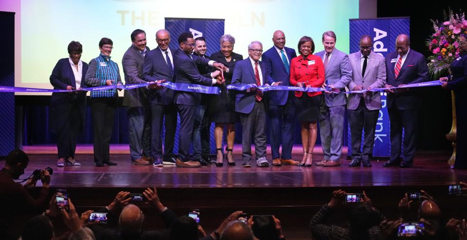 City and state officials and bank executives take part in the Adelphi Bank ribbon-cutting ceremony on Monday at the Lincoln Theatre. Adelphi is currently the only Black-owned bank in Ohio.