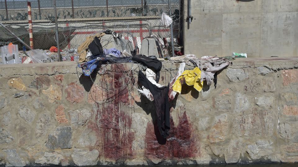Clothes and blood stains at the scene on August 27, 2021. - Wakil Koshar/AFP/Getty Images