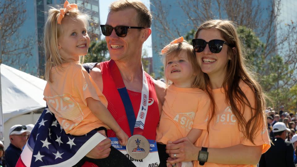 Young poses with his family after achieving his dream of making the Olympic team. - Kirby Lee/USA Today Sports via Reuters