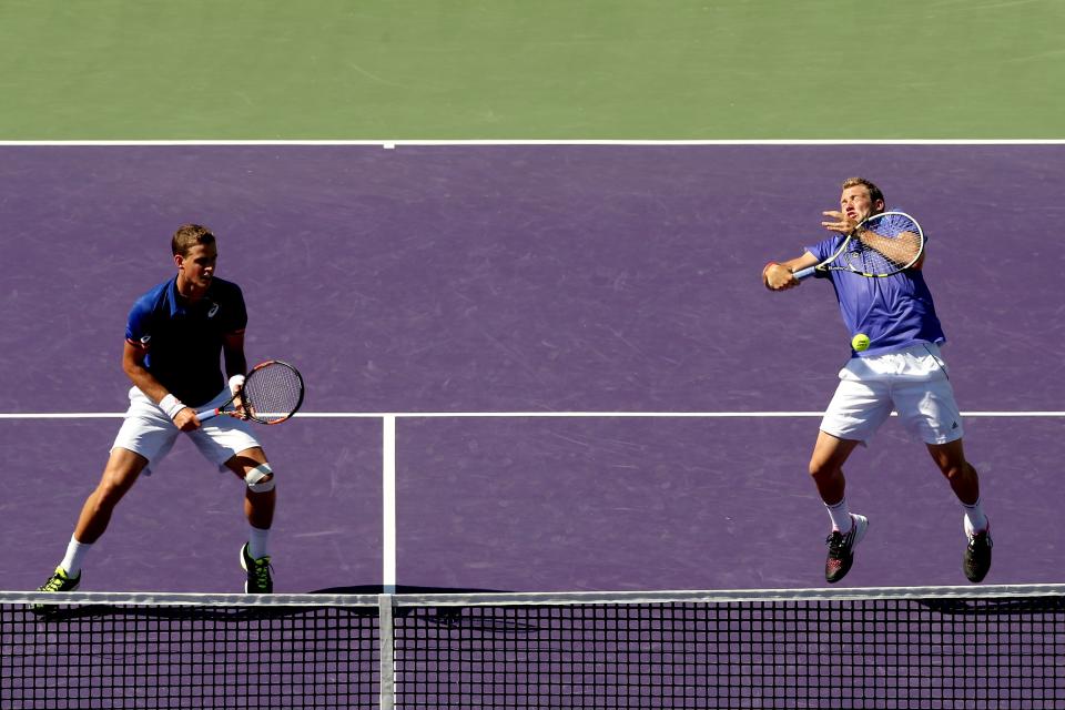 Vasek Pospisil of Canada and Jack Sock play Bob Bryan and Mike Bryan during the doubles final Saturday. (Matthew Stockman/Getty Images)