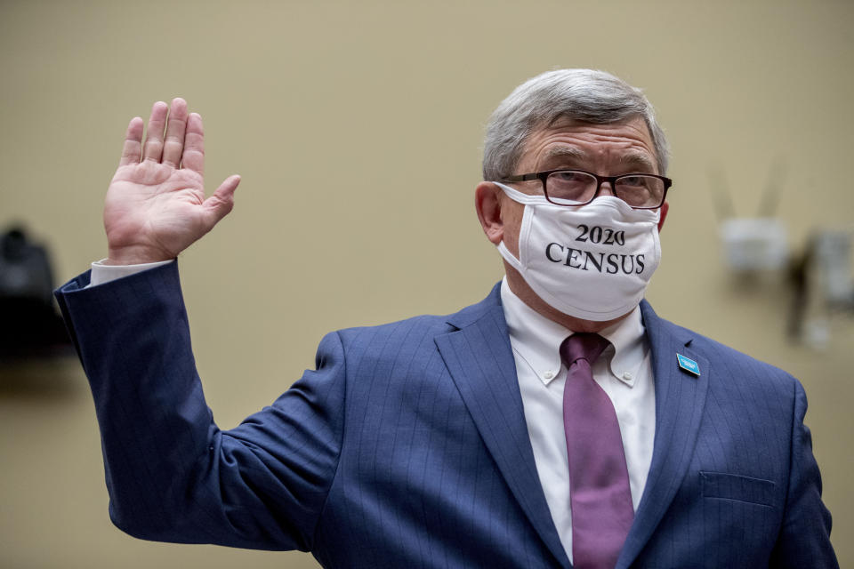 Census Bureau Director Steven Dillingham wears a mask with the words "2020 Census" as he is sworn in to testify before a House Committee on Oversight and Reform hearing on the 2020 Census​ on Capitol Hill, Wednesday, July 29, 2020, in Washington. (AP Photo/Andrew Harnik)