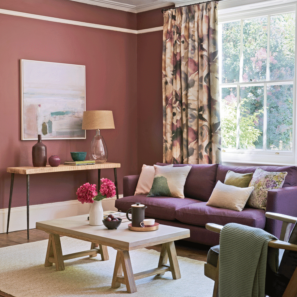 Red living room with patterned curtains