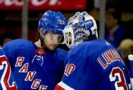 Nov 12, 2018; New York, NY, USA; New York Rangers goaltender Henrik Lundqvist (30) is congratluated by center Ryan Spooner (23) after defeating the Vancouver Canucks at Madison Square Garden. Mandatory Credit: Andy Marlin-USA TODAY Sports