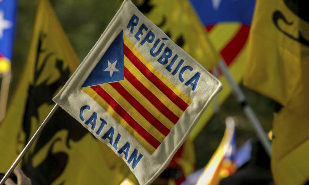 Flags and banners at a pro-Catalan independence rally in Brussels, Belgium