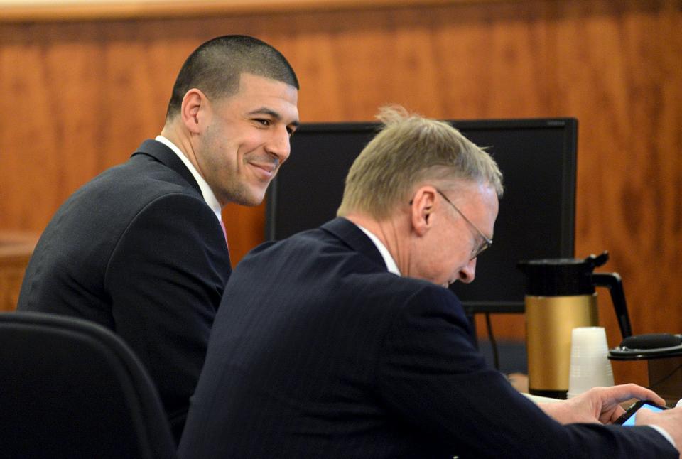 Former New England Patriots football player Aaron Hernandez (L) appears with defence attorney Charles Rankin in the courtroom of of the Bristol County Superior Court House in Fall River, Massachusetts April 8, 2015. Jurors in ex-NFL star Hernandez's murder trial resumed deliberations at the Massachusetts court on Wednesday, a day after the defense argued he was only a witness to the killing that prosecutors say he orchestrated. REUTERS/Faith Ninivaggi