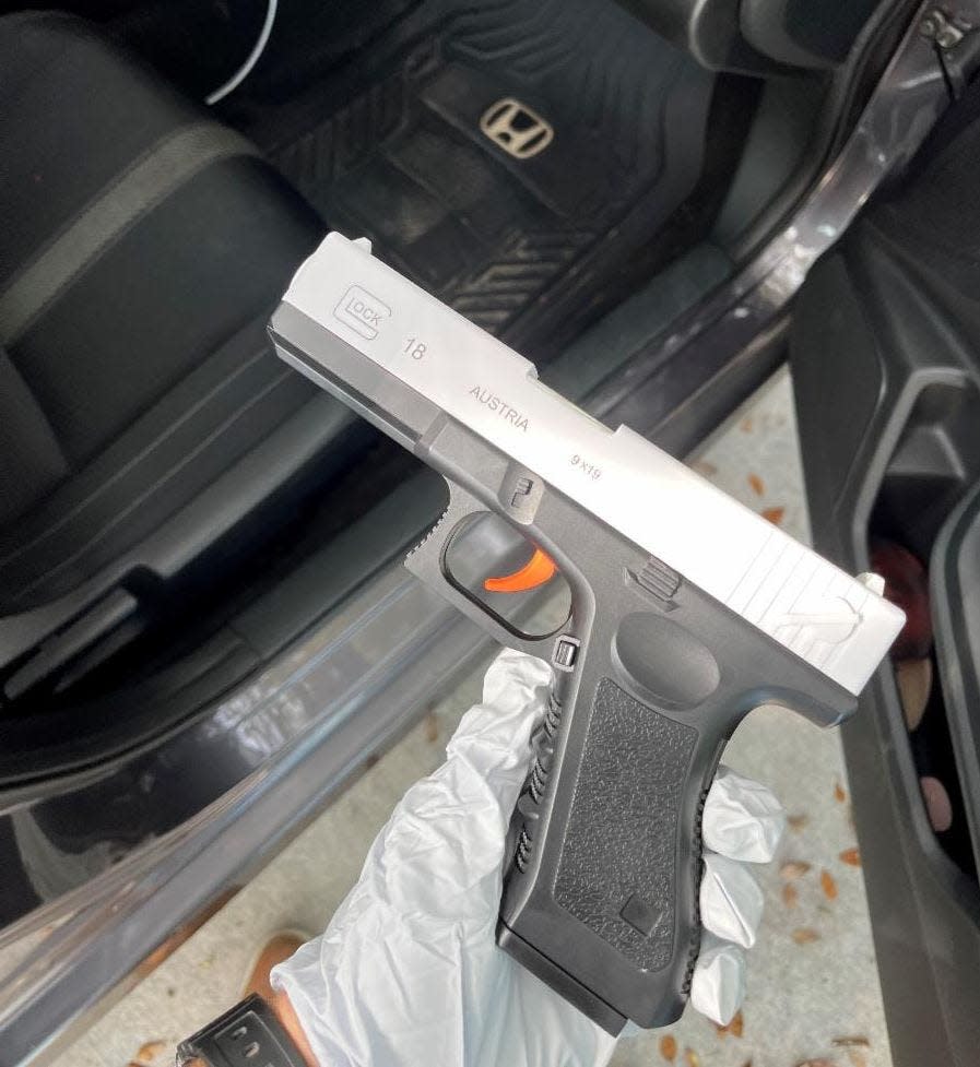 Adrian Araujo-Garcia, 18, of Lakeland, was arrested Wednesday after an employee of Resurrection Catholic Church's private school saw him in the parking lot with a toy gun, pictured here, raising concerns that caused the school to go into lockdown.