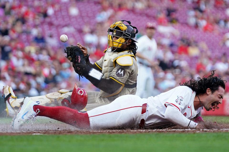 Cincinnati Reds second base Jonathan India (6) is called safe at home as San Diego Padres catcher Luis Campusano (12) attempts to make the tag in the second inning of a baseball game, Tuesday, May 21, 2024, at Great American Ball Park in Cincinnati.