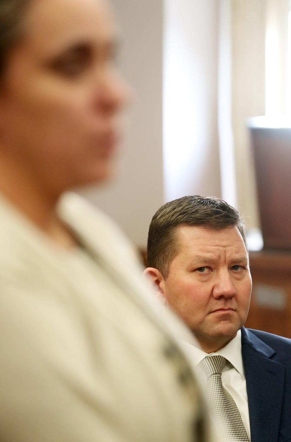 Barberton City Prosecutor Jennifer Roberts addresses the court as former state Rep. Bob Young listens during Young's sentencing Friday in Barberton Municipal Court.