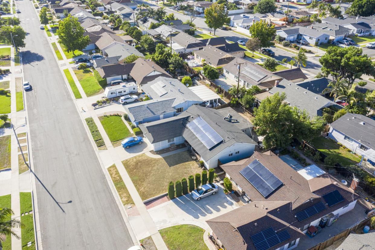 An aerial of a suburban neighborhood in southern California on a sunny day