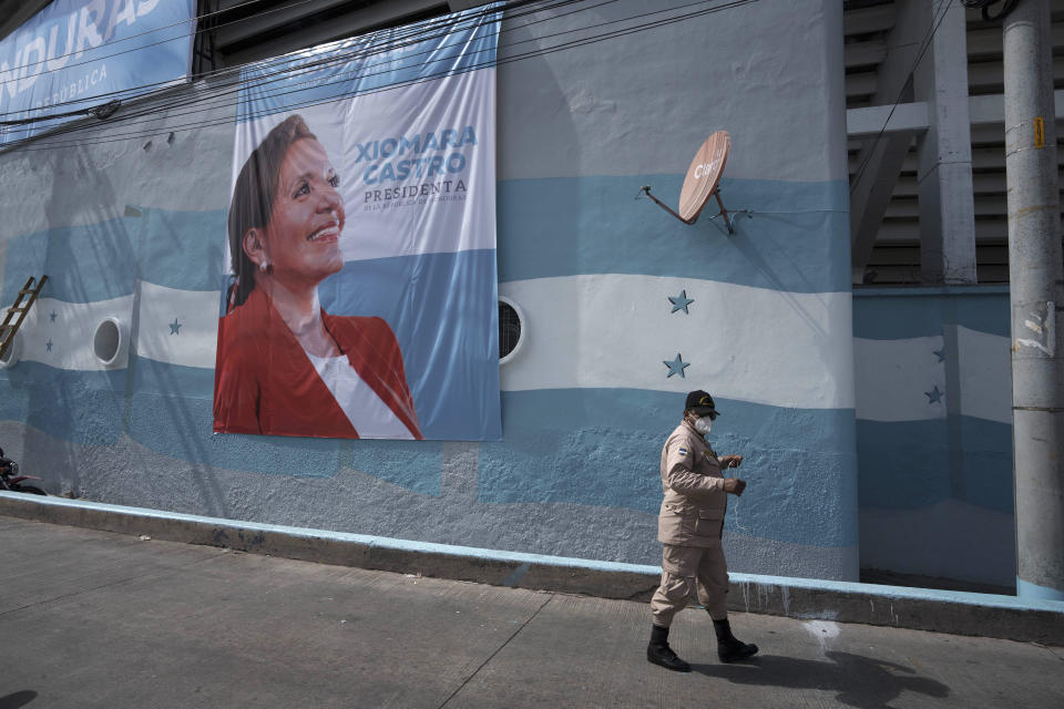 A banner promoting President-elect Xiomara Castro hangs on a wall at the National Stadium in Tegucigalpa, Honduras, Wednesday, Jan. 26, 2022. Castro, Honduras' first female president, is scheduled to be sworn in during a ceremony at the stadium on Thursday, Jan. 27. (AP Photo/Moises Castillo)