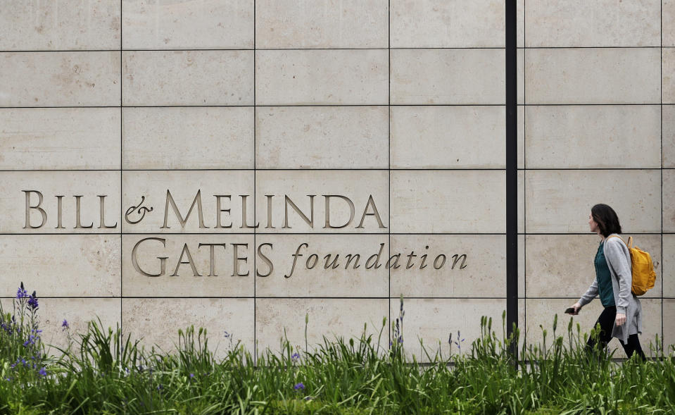 FILE - A person walks by the headquarters of the Bill and Melinda Gates Foundation on April 27, 2018, in Seattle. The Bill & Melinda Gates Foundation threw its weight behind a call to save the lives of women in child birth and their children on Wednesday, Sept. 20, 2023, at its annual Goalkeepers conference on the side lines of the U.N. General Assembly in New York. (AP Photo/Ted S. Warren, File)