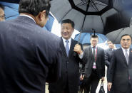 China's President Xi Jinping is greeted on his arrival at Kansai International Airport in Izumisano, Osaka prefecture, western Japan, Thursday, June 27, 2019. Group of 20 leaders gather in Osaka on June 28 and 29 for their annual summit.(Kyodo News via AP)