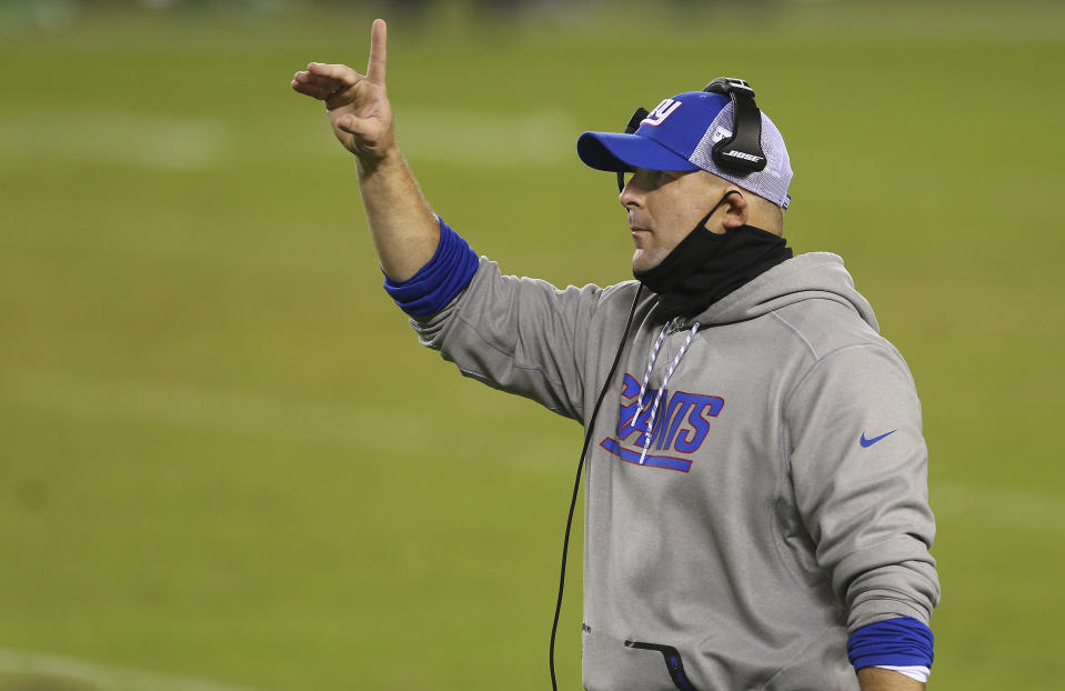 FILE - In this Oct. 22, 2020, file photo, New York Giants coach Joe Judge gestures during the team's NFL football game against the Philadelphia Eagles in Philadelphia. The Giants play the Tampa Bay Buccaneers this week. The game will feature six-time Super Bowl champion Tom Brady against Judge, one of his former coaches with the New England Patriots. The two shared three Super Bowl wins. The Bucs have a 5-2 record. Their only loss in the recent run was a one-point decision to Chicago. The Giants are 1-6 under the 38-year-old Judge. (AP Photo/Rich Schultz, File)