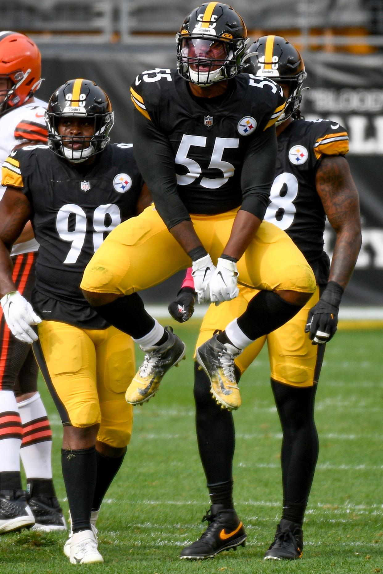 Pittsburgh Steelers inside linebacker Devin Bush (55) celebrates a defensive play against the Cleveland Browns during the first half of an NFL football game, Sunday, Oct. 18, 2020, in Pittsburgh. (AP Photo/Don Wright)