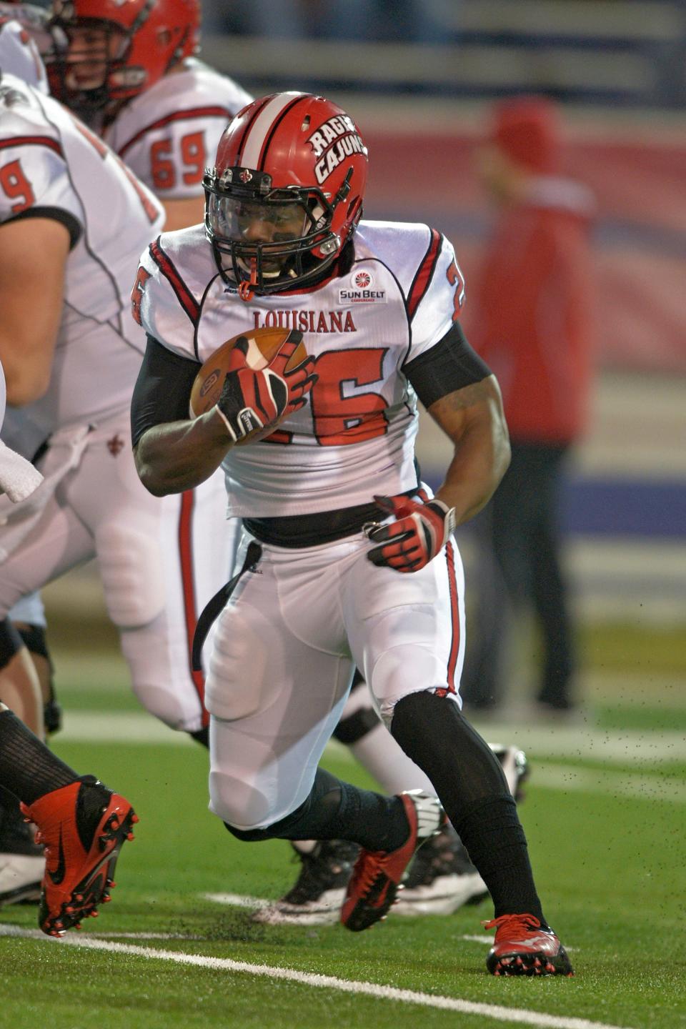 Louisiana running back Effrem Reed (26) carries the ball during warm-ups before a game against South Alabama in Mobile on Dec. 7, 2013.