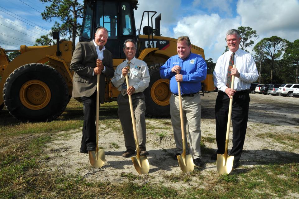 West Melbourne City Manager Scott Morgan, right, holds a golden shovel during D.R. Horton's December 2013 groundbreaking ceremony for the future Sawgrass Lakes subdivision off Minton Road. Also pictured, from left, are D.R. Horton Division President Keith Williams, Mayor Hal Rose and the late Brevard County Commissioner Andy Anderson.