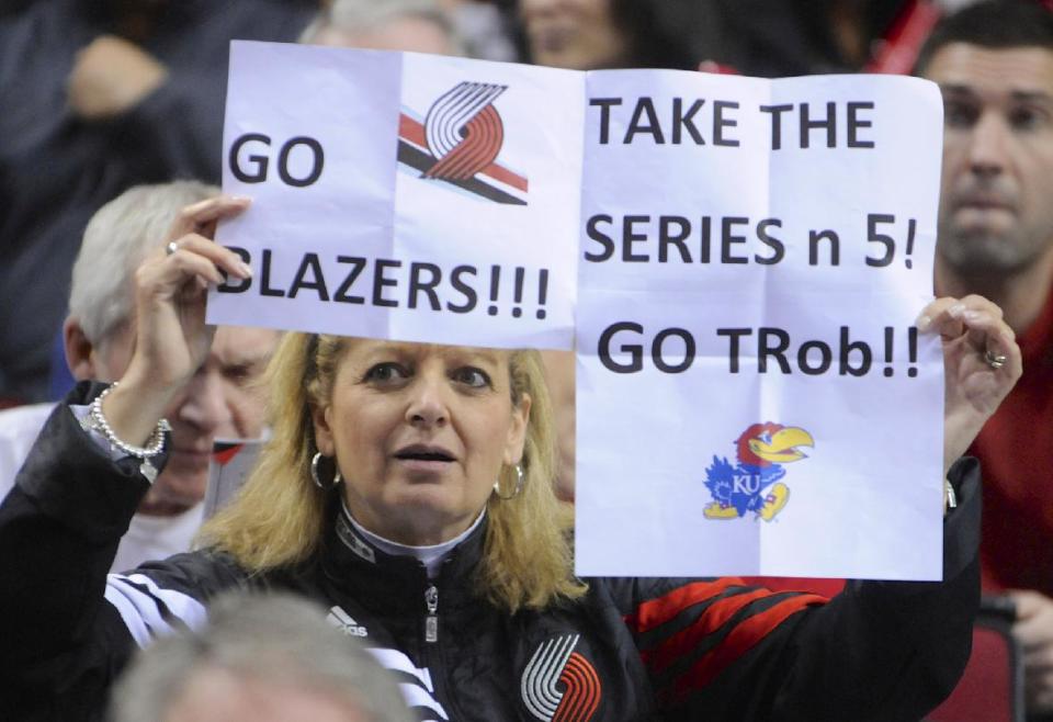 Portland Trail Blazers' supporter Brenda Mills holds up her sign during the first half of game four of an NBA basketball first-round playoff series game against the Houston Rockets in Portland, Ore., Sunday March 30, 2014. (AP Photo/Greg Wahl-Stephens)