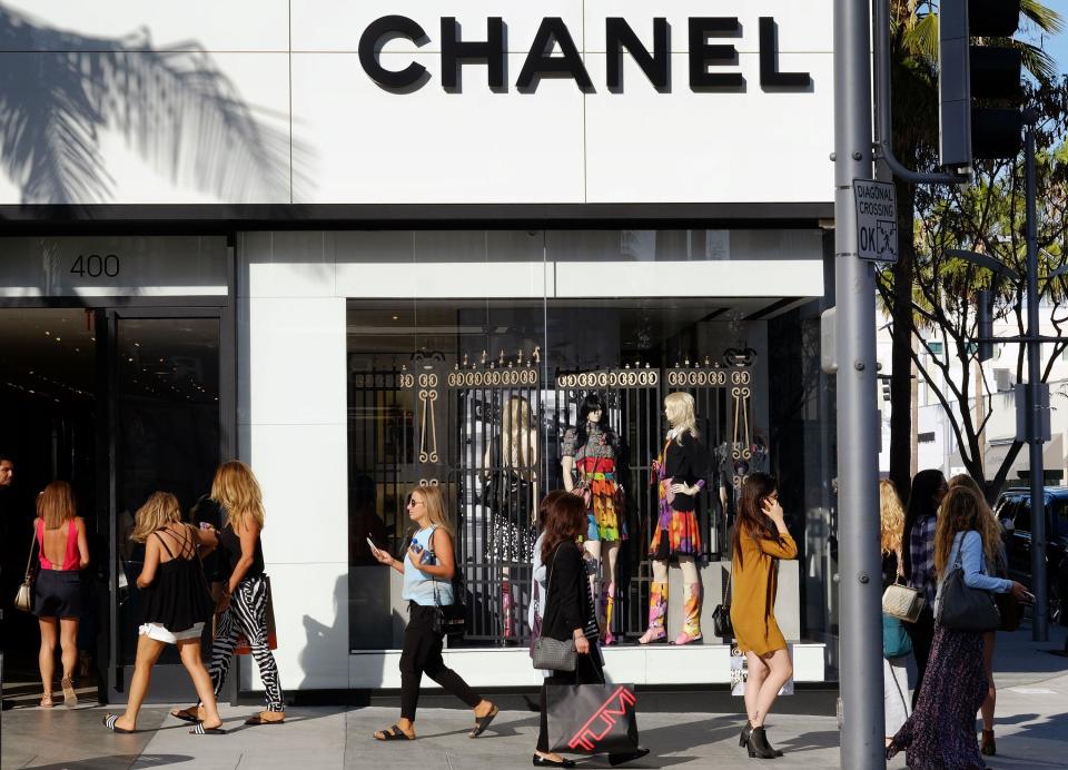 ftse In this Thursday, April 2, 2015 photo, shoppers walk past the Chanel Boutique on Rodeo Drive in Beverly Hills, Calif. The euro has fallen 10 percent against the dollar this year, but European luxury goods sold in the U.S. still carry luxurious price tags. (AP Photo/Richard Vogel)