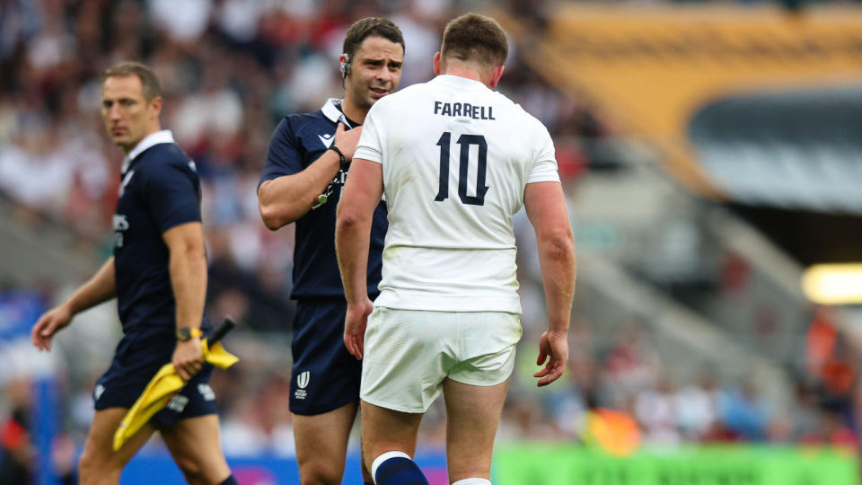 Referee Nika Amashukeli speaks to England fly-half Owen Farrell. Credit: Alamy