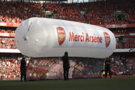 <p>A balloon bearing the words “Merci Arsene” is installed on the pitch after the English Premier League soccer match between Arsenal and Burnley at the Emirates Stadium in London, Sunday, May 6, 2018. The match is Arsenal manager Arsene Wenger’s last home game in charge after announcing in April he will stand down as Arsenal coach at the end of the season after nearly 22 years at the helm. (AP Photo/Matt Dunham) </p>