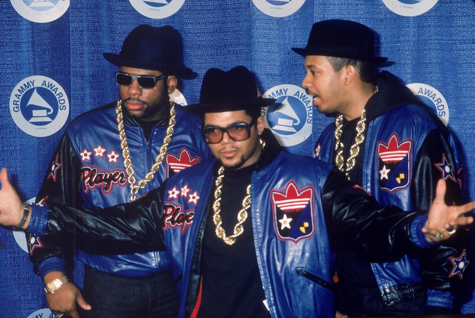 Jason "Jam Master Jay" Mizell, left, Joseph "DJ Run" Simmons and Darryl "DMC" McDaniels, of the rap group Run-DMC, pose at the Grammy Awards in this file photo from the 1980s.