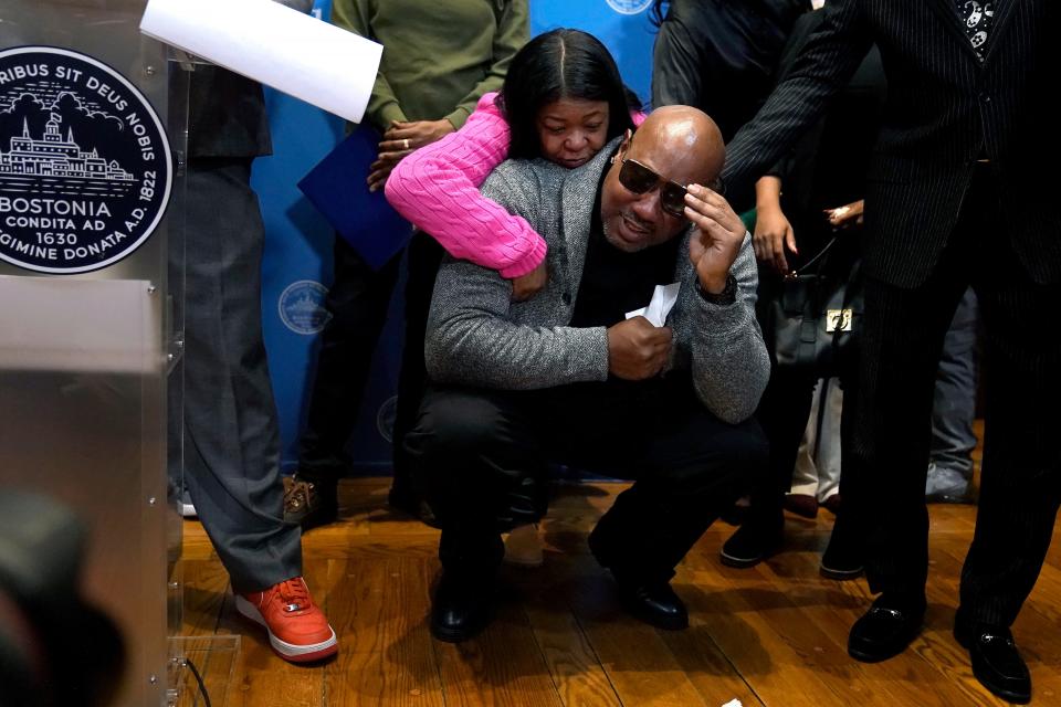 Joseph Bennett, below, nephew of Willie Bennett, who was wrongly accused in the 1989 death of Carol Stuart, is comforted by a family member as he becomes emotional during a news conference, Wednesday, Dec. 20, 2023, in Boston. Boston Mayor Michelle Wu issues a formal apology to Alan Swanson and Willie Bennett during the news conference for their wrongful arrests following the 1989 death of Carol Stuart, whose husband, Charles Stuart, had orchestrated her murder.