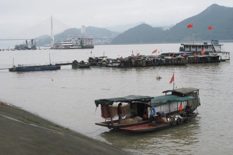 Chinese flags are seen on boats on the Yangtze river in Fengdu county in Chongqing