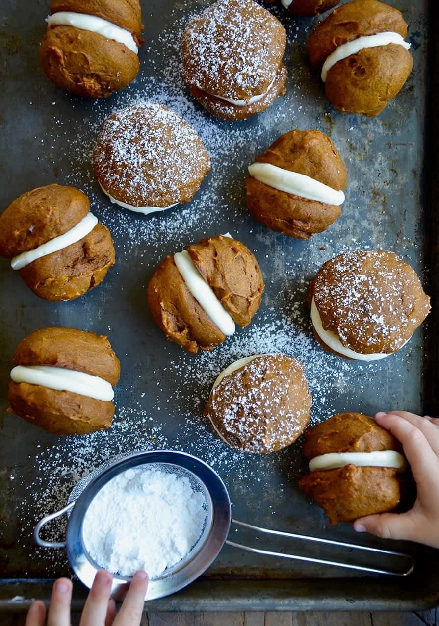 Pumpkin whoopie pies with powdered sugar