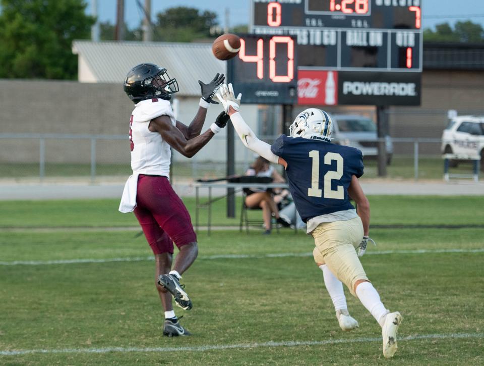 The pass to Tyrell Marshall (5) in the end zone falls incomplete during the Navarre vs Gulf Breeze spring football game at Gulf Breeze High School on Friday, May 19, 2023.