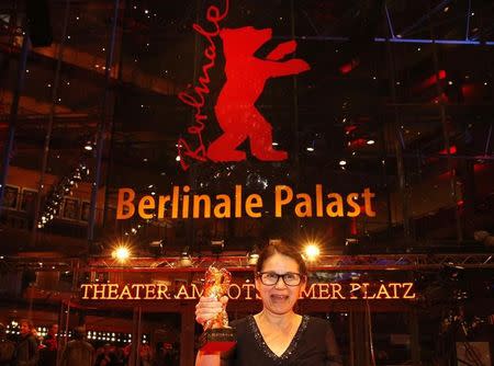 Director Ildiko Enyedi shows the Golden Bear for Best Film 'On Body and Soul' after the awards ceremony at the 67th Berlinale International Film Festival in Berlin, Germany, February 18, 2017. REUTERS/Axel Schmidt