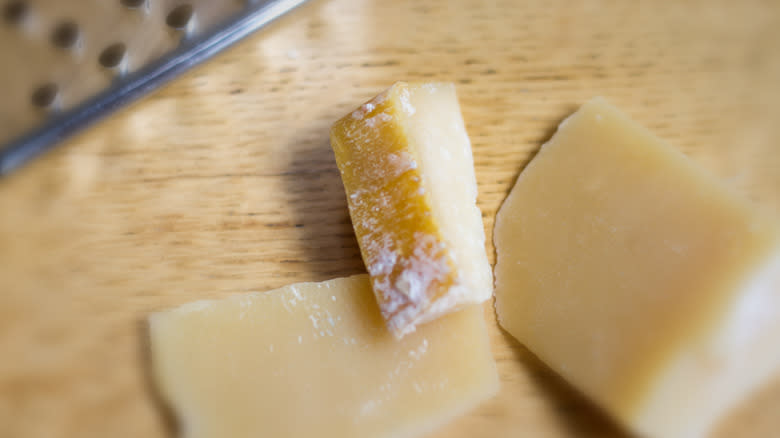 parmesan rinds on wooden background