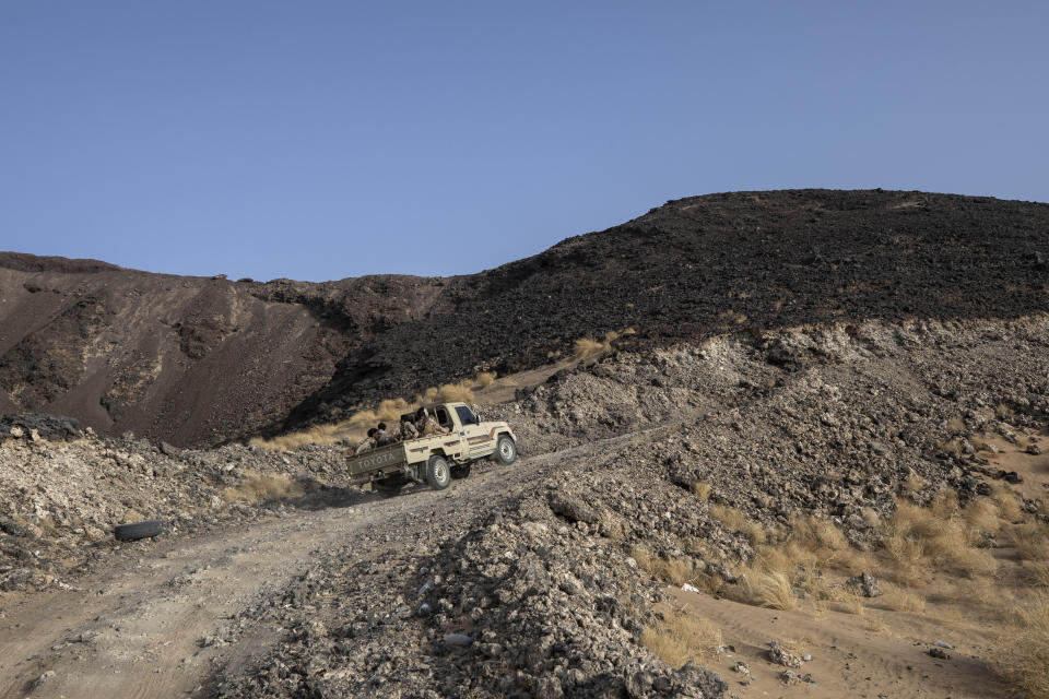 Yemeni fighters backed by the Saudi-led coalition make their way to the Kassara frontline near Marib, Yemen, Sunday, June 20, 2021. (AP Photo/Nariman El-Mofty)