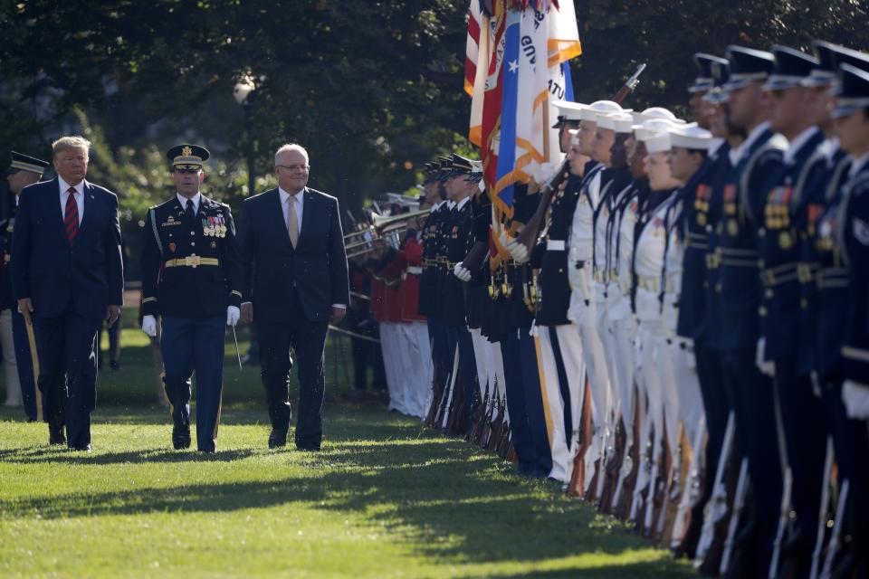 President Donald Trump and Australian Prime Minister Scott Morrison review troops during a State Arrival Ceremony on the South Lawn of the White House in Washington, Friday, Sept. 20, 2019.