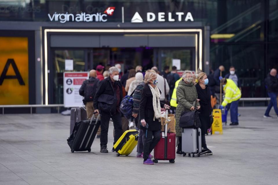 Passengers arrive at Heathrow’s Terminal 3 as the US reopens its borders to UK (Steve Parsons) (PA Wire)