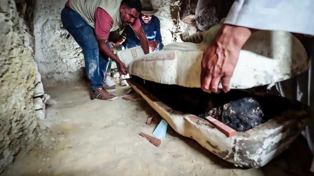 A 3,000-year-old coffin is opened in a burial chamber at the Saqqara in Giza site near Cairo. (TODAY)