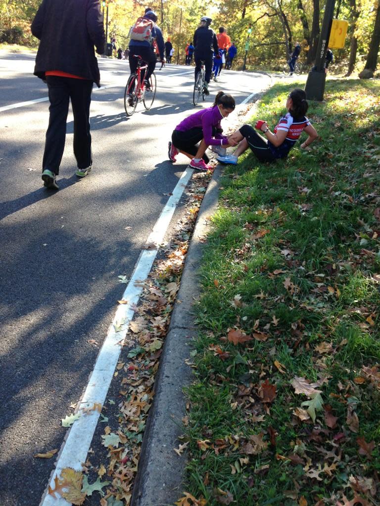 Stretching so they can finish the #unofficial #nycmarathon #teamwork