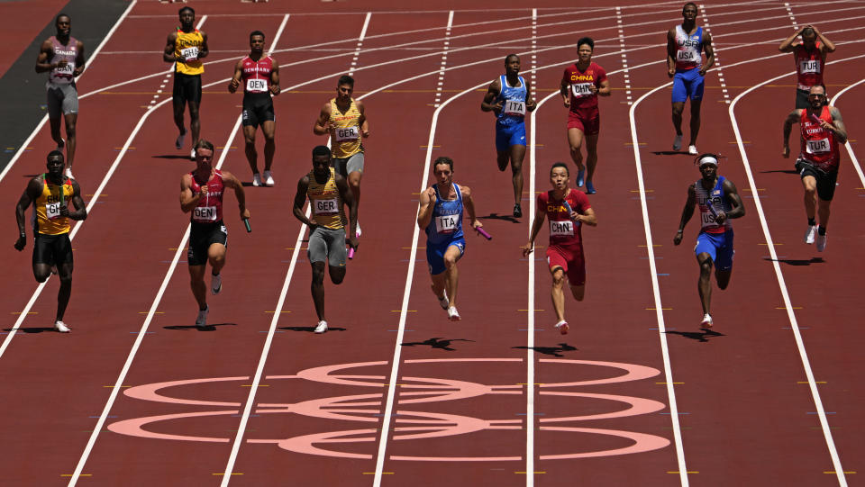 Zhiqiang Wu, of China anchors his team to win a semifinal of the men's 4 x 100-meter relay at the 2020 Summer Olympics, Thursday, Aug. 5, 2021, in Tokyo, Japan. (AP Photo/Charlie Riedel)