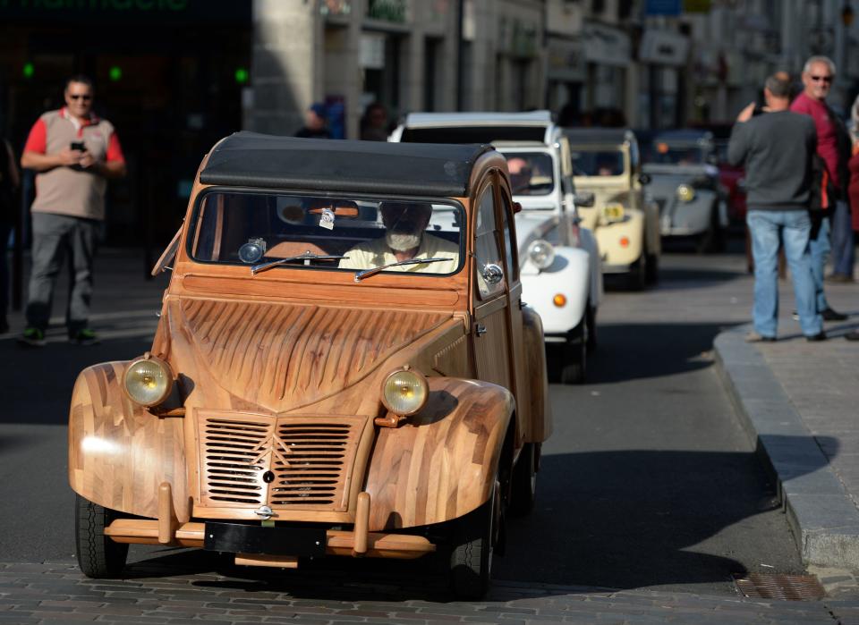 French cabinetmaker Michel Robillard drives his wooden Citroen 2CV car in Loches, France, in a September 23, 2017 file photo. / Credit: GUILLAUME SOUVANT/AFP/Getty