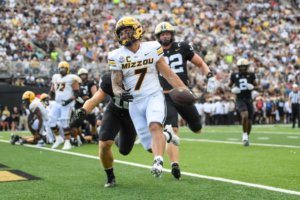 Sep 30, 2023; Nashville, Tennessee, USA; Missouri Tigers running back Cody Schrader (7) scores on a one-yard run against the Vanderbilt Commodores during the first half at FirstBank Stadium. Mandatory Credit: Steve Roberts-USA TODAY Sports