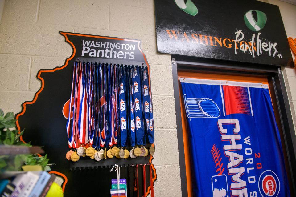 State medals hang on the back wall of Washington Community High School athletic director Herb Knoblauch's office. Knoblauch is retiring after fourteen years as the school's AD and three decades in education.